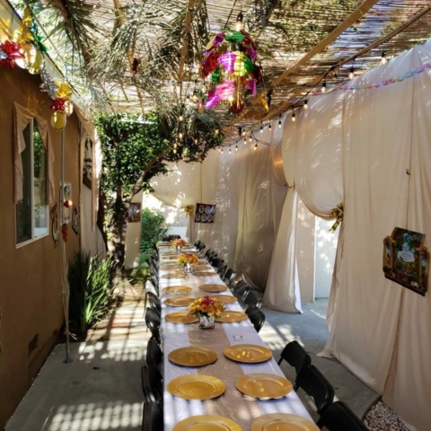 Sukkot at The Malul's, Sukkah and Table - AishLIT Website 1